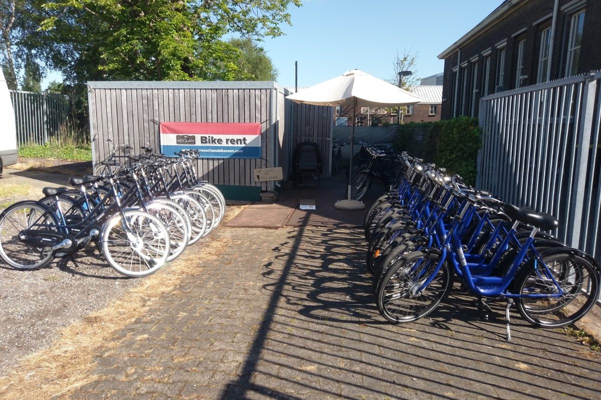 Rental bikes lined up at the Bike rent stand next to Zaanse Schans station